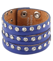 1.5" width leather wristband  leather with 6 strands cut out design and alternating rhinestone and silver studs.